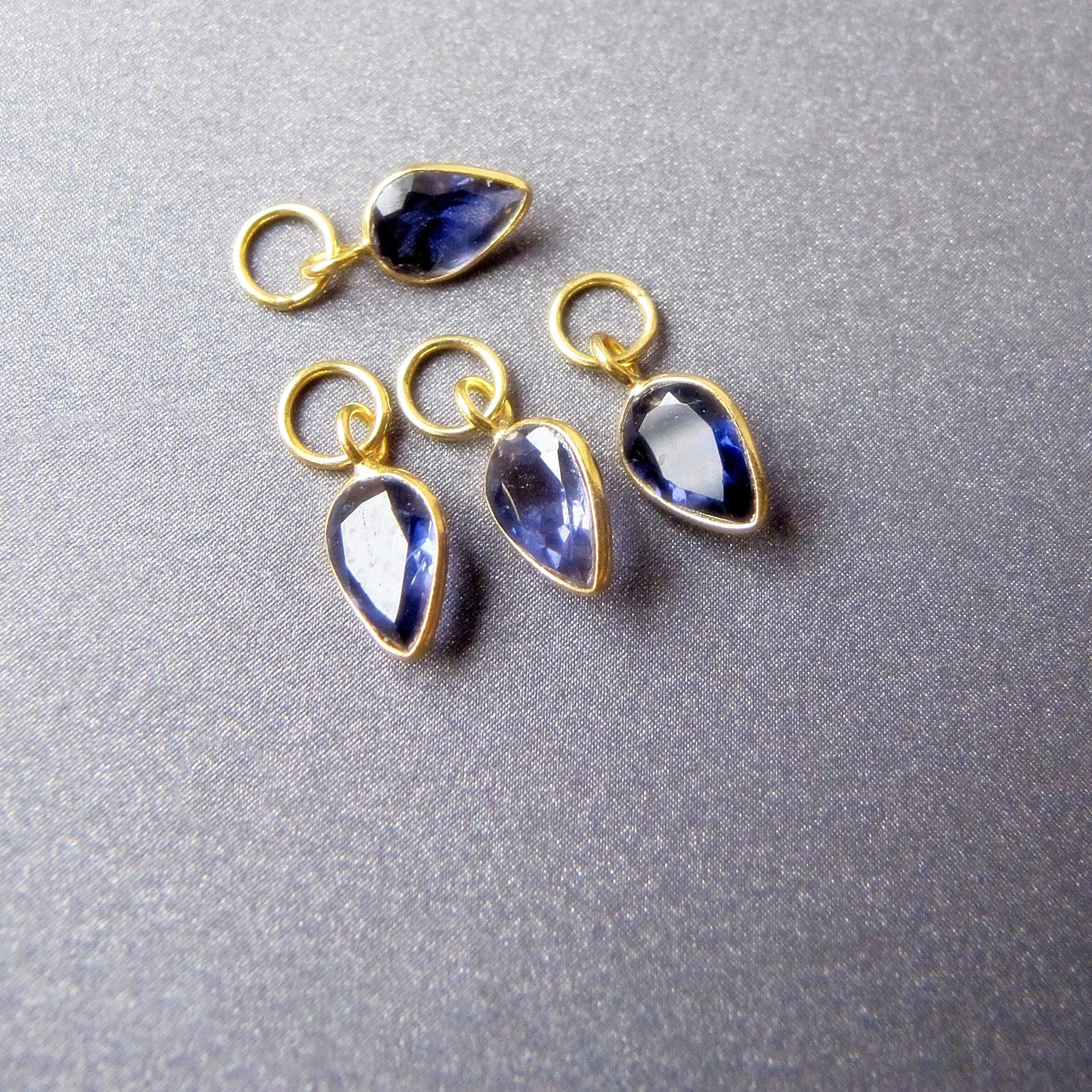 18k Gold Iolite Acorn Charm For Earrings • 6x4mm Natural Gemstone • 4mm Ring / 3mm Hole • Removable Dangle Drop For Hoops Huggies 18k Gold Iolite Acorn Charm For Earrings • 6x4mm Natural Gemstone • 4mm Ring / 3mm Hole • Removable Dangle Drop For Hoops Huggies
