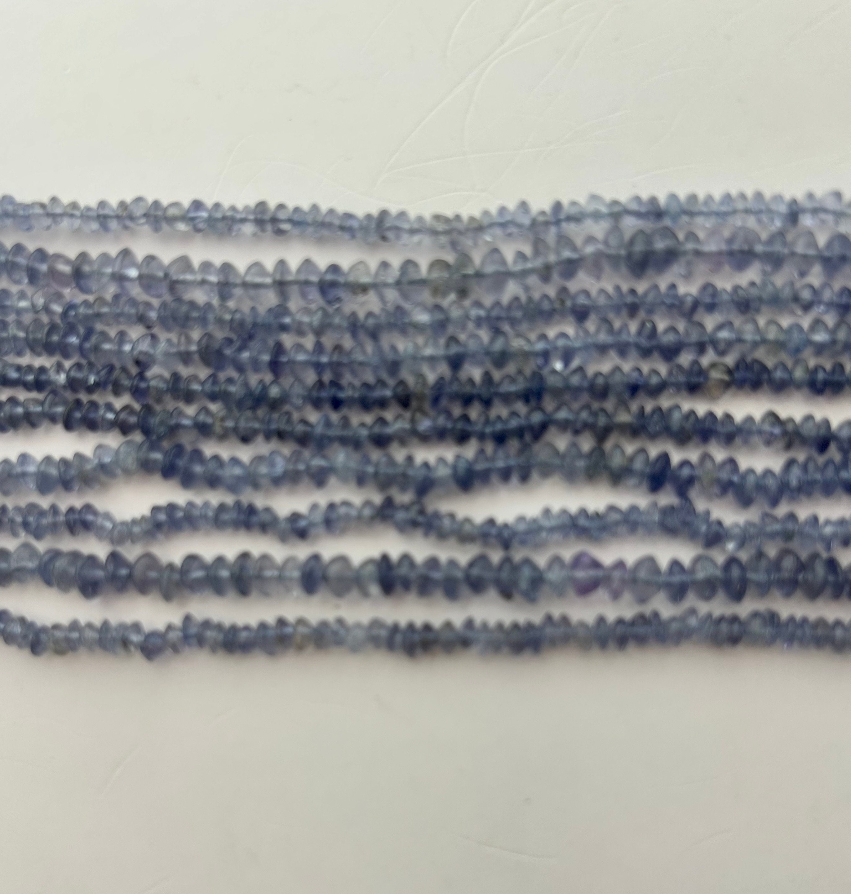3-4mm Rondelle Iolite Gemstone Beads. 15” Strand Of Rondelle Iolite, Approx. 3-4mm In Diameter And 2-3mm In Width. 3-4mm Rondelle Iolite Gemstone Beads. 15” Strand Of Rondelle Iolite, Approx. 3-4mm In Diameter And 2-3mm In Width.