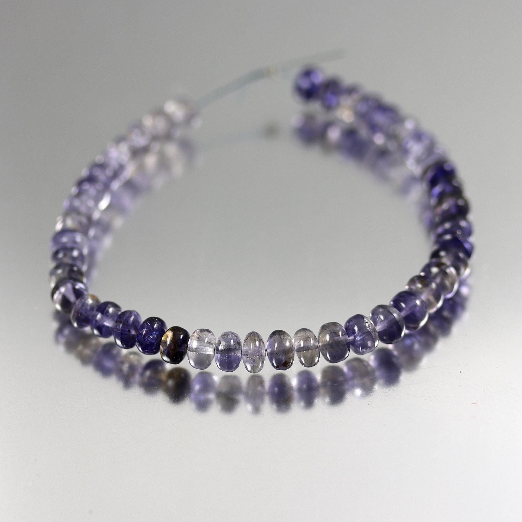 Shaded Iolite Smooth Rondelle Beads - Set Of 43 - 6 To 7mm Shaded Iolite Smooth Rondelle Beads - Set Of 43 - 6 To 7mm