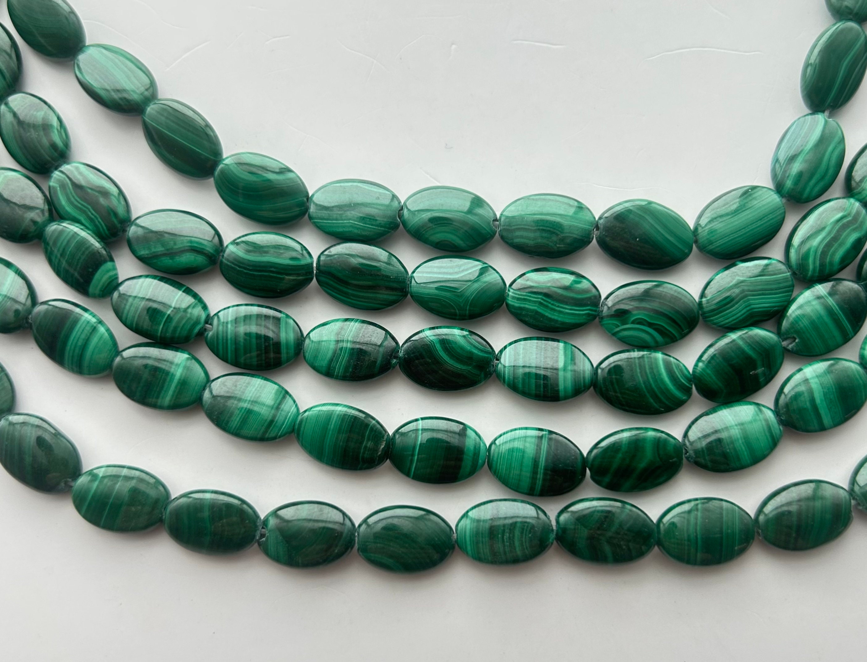 8x12mm Flat Oval Malachite Gemstone Beads. Full 15" Strand Of Banded Green Malachite Beads, Approx. 33 Per Strand. 8x12mm Flat Oval Malachite Gemstone Beads. Full 15" Strand Of Banded Green Malachite Beads, Approx. 33 Per Strand.