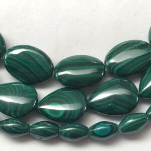 Genuine Malachite beads on 15 inch strand. Rice, oval and teardrop shapes available. Full strand of beautiful dark green AA/AAA Grade beads. Genuine Malachite beads on 15 inch strand. Rice, oval and teardrop shapes available. Full strand of beautiful dark green AA/AAA Grade beads.
