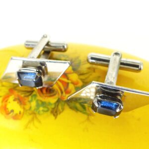 Modern prong set brilliant blue faceted crystal cufflinks, mounted on a shiny silver Off set slanted rectangle. Free gift packaging