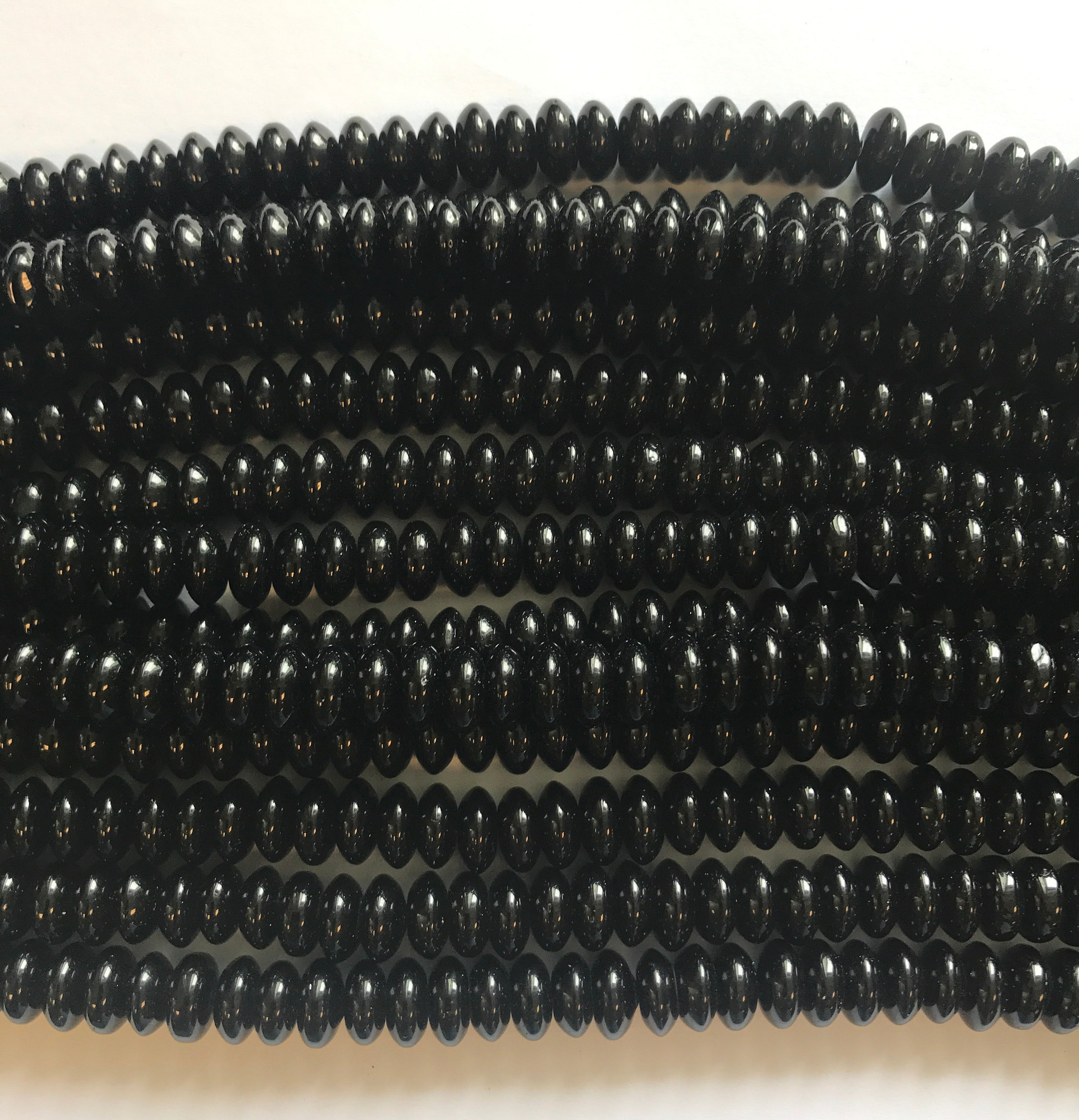 Onyx 10x5mm Rondelle Gemstone Beads - 15.5 Inch Strand Onyx 10x5mm Rondelle Gemstone Beads - 15.5 Inch Strand