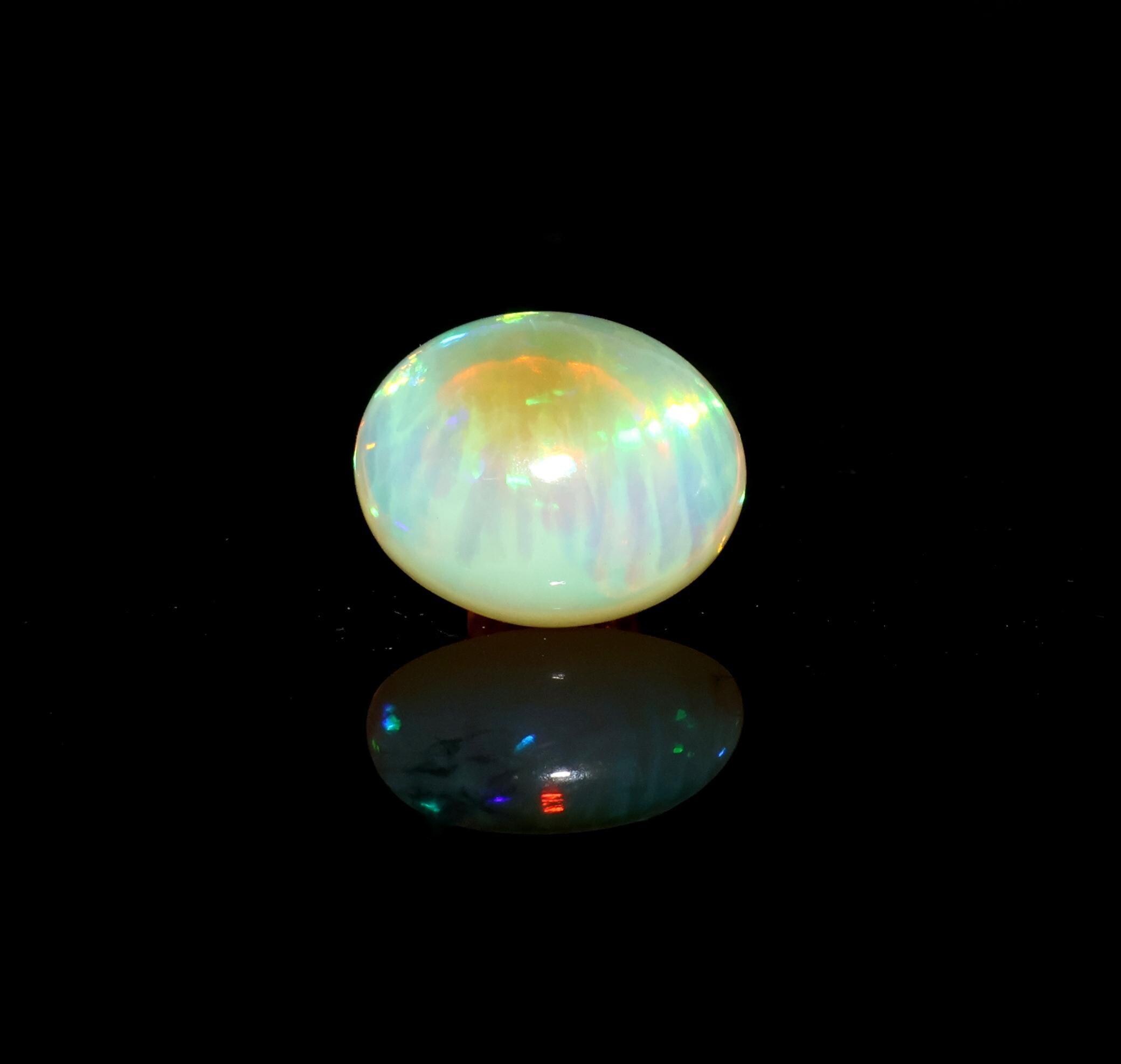 3.85 Carat, Natural Ethiopian Opal Cabochon, Genuine Fire Opal Gemstone, 13x10.50 Mm 3.85 Carat, Natural Ethiopian Opal Cabochon, Genuine Fire Opal Gemstone, 13x10.50 Mm