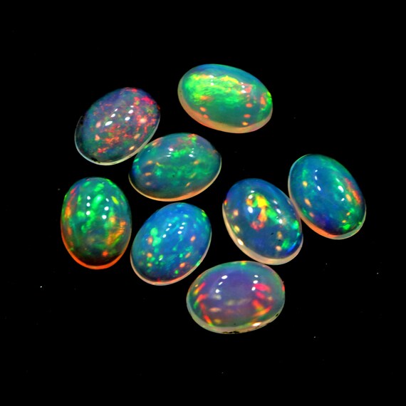 Ethiopian Opal Cabochons: 4 Ct Oval Welo Fire Opal, 5x7 Mm Loose Opals Ethiopian Opal Cabochons: 4 Ct Oval Welo Fire Opal, 5x7 Mm Loose Opals