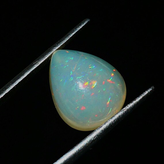 Ethiopian Dot Fire Opal Cabochon: Pear Cut Gemstone, 3.80 Carat