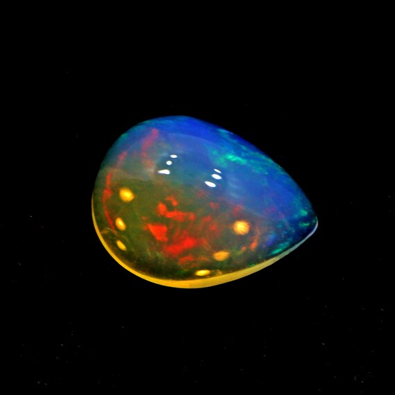 Ethiopian Fire Opal: 3 Ct Pear Cut Galaxy Opal Cabochon (10x13 Mm)
