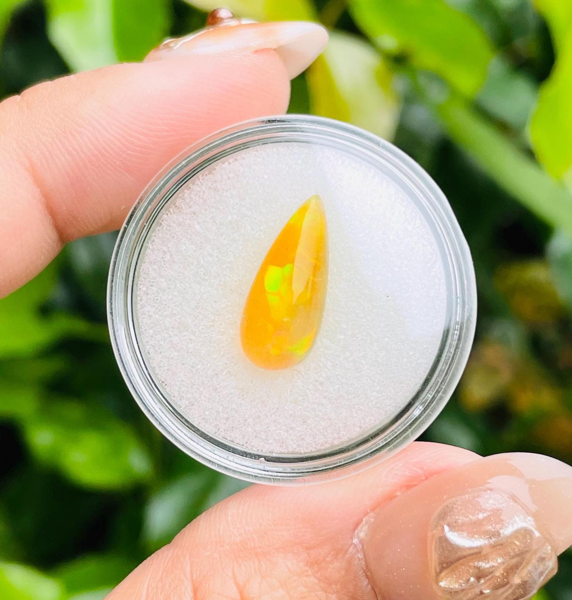 Ethiopian Honeycomb Opal Cabochon: Brown Fire Opal Tear Drop (15.7x6.6x5mm) Ethiopian Honeycomb Opal Cabochon: Brown Fire Opal Tear Drop (15.7x6.6x5mm)