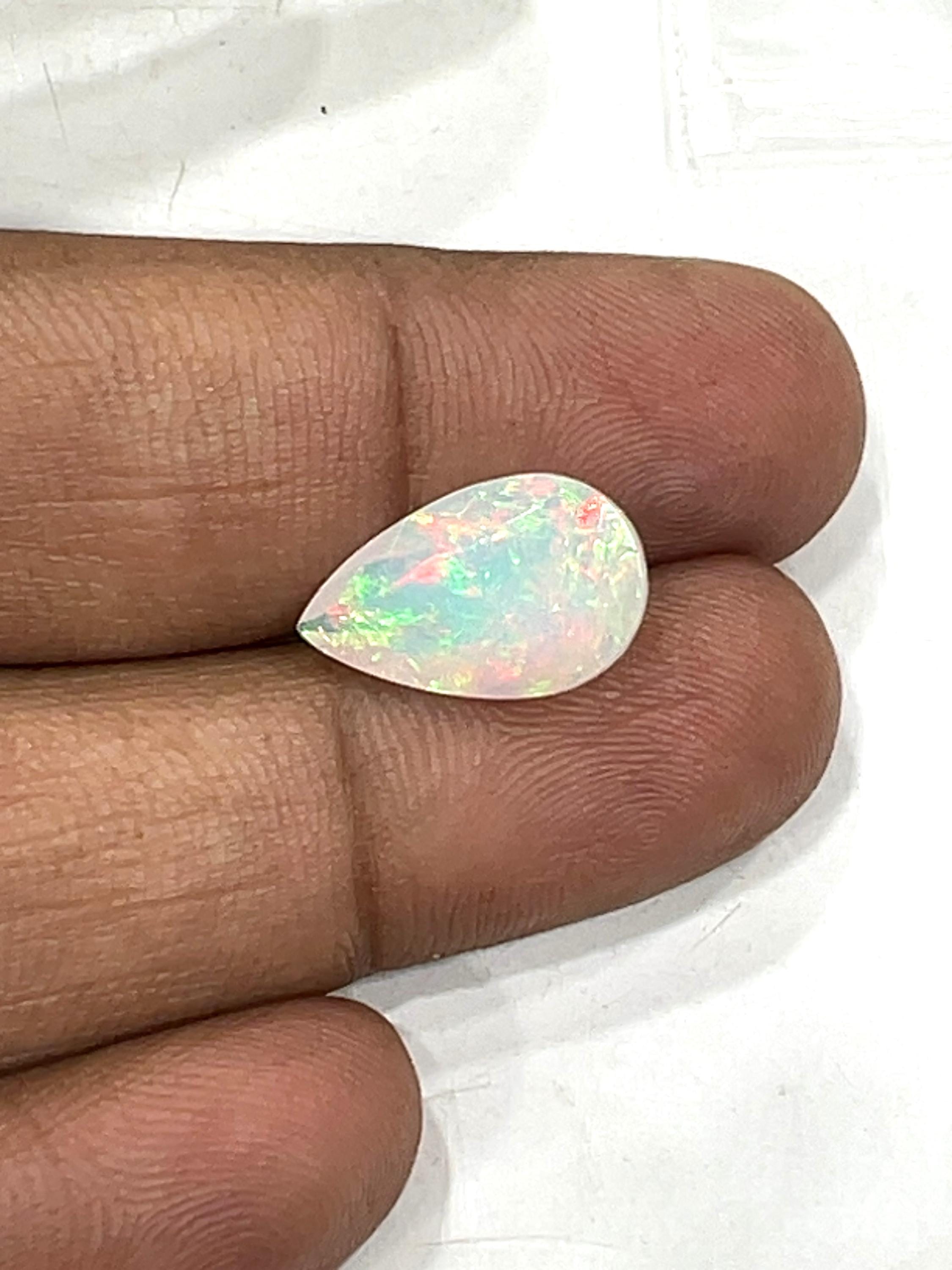 Ethiopian Opal Stone: 3.65 Ct Pear Cabochon, Flashy Gemstone Ethiopian Opal Stone: 3.65 Ct Pear Cabochon, Flashy Gemstone