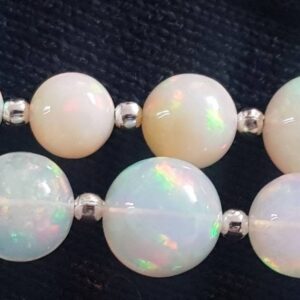 Ethiopian Opal Round 5-9mm Graduated: 8" Strand (25 Beads Approx.)
