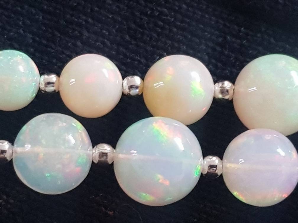 Ethiopian Opal Round 5-9mm Graduated: 8" Strand (25 Beads Approx.)