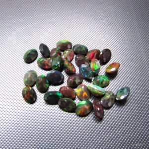 Faceted Black Ethiopian Opal: Aaa Oval Loose Gemstone (5x7mm)