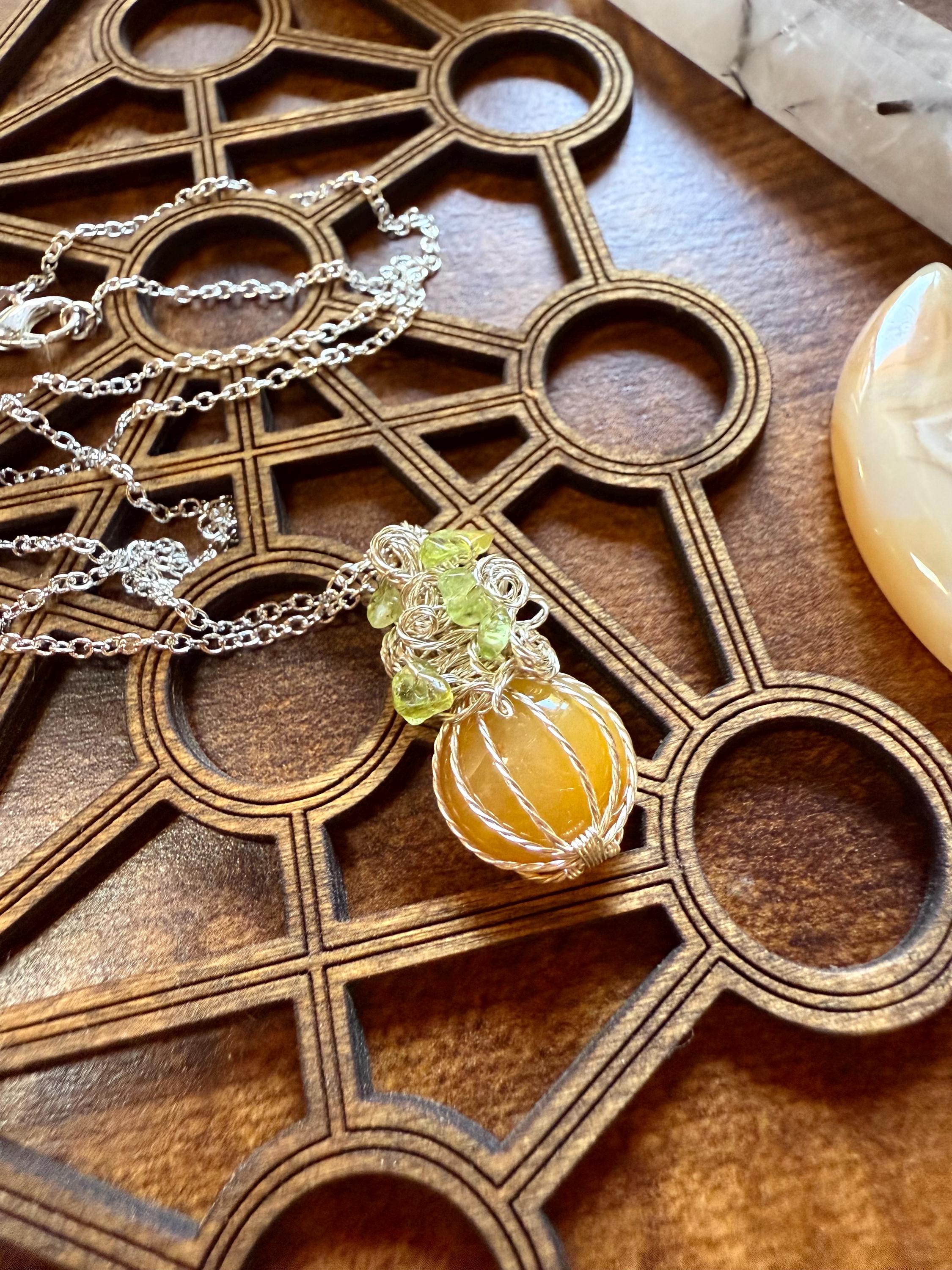 Mini Calcite Pumpkin Pendant » Mini Wire Wrapped Pumpkin Necklace » Crystal Pumpkin Necklace With Orange Calcite And Peridot Mini Calcite Pumpkin Pendant » Mini Wire Wrapped Pumpkin Necklace » Crystal Pumpkin Necklace With Orange Calcite And Peridot