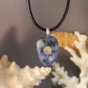 Sodalite Stone Pendant Inlaid with Sterling Silver Rings and Orange Calcite Gemstone with a Sterling Silver Bail.