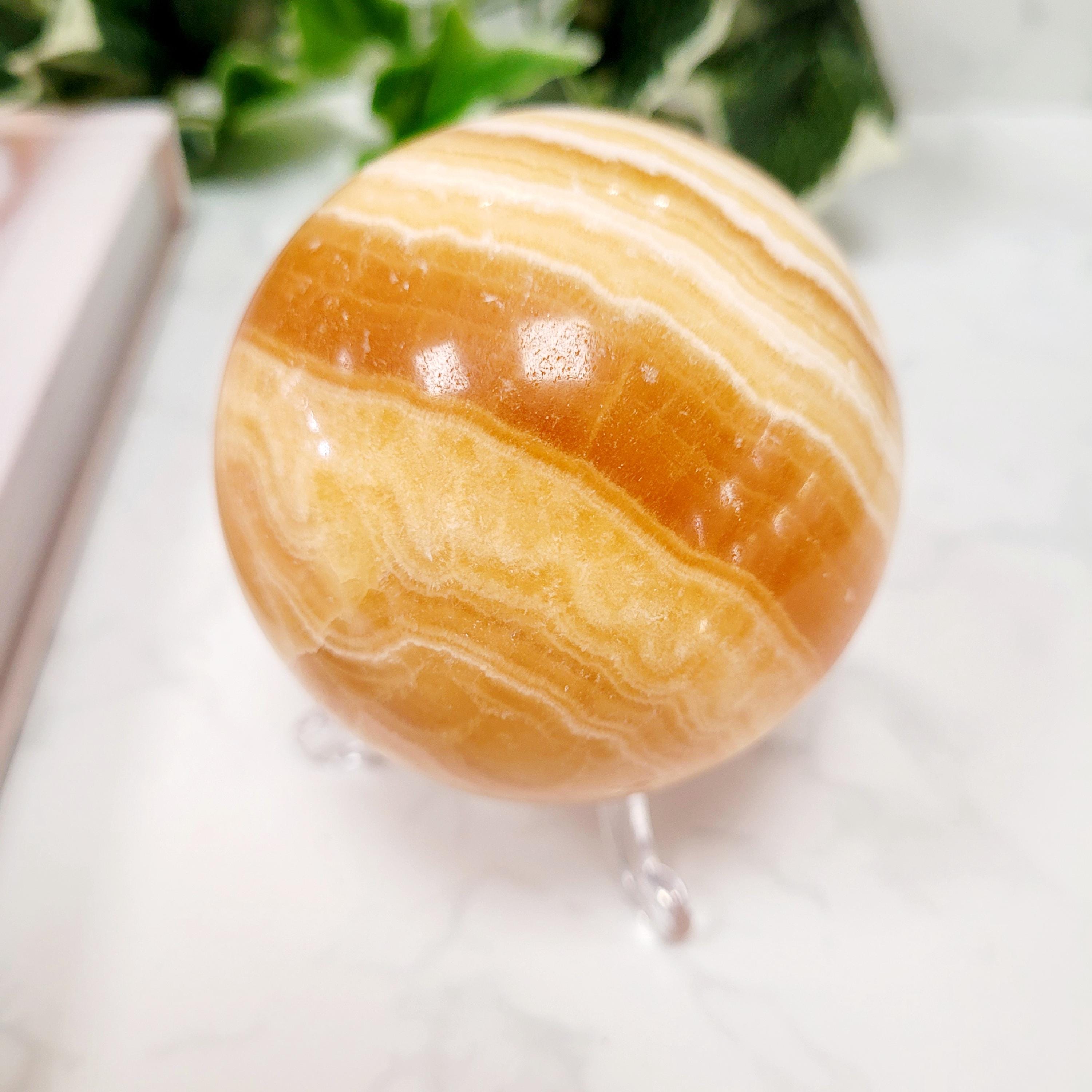 Orange Calcite Crystal Sphere • Ethically Sourced