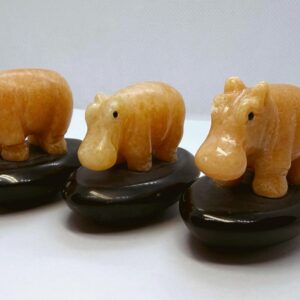 Hand-Carved Orange Calcite Hippo Figurines on Agate Bases.