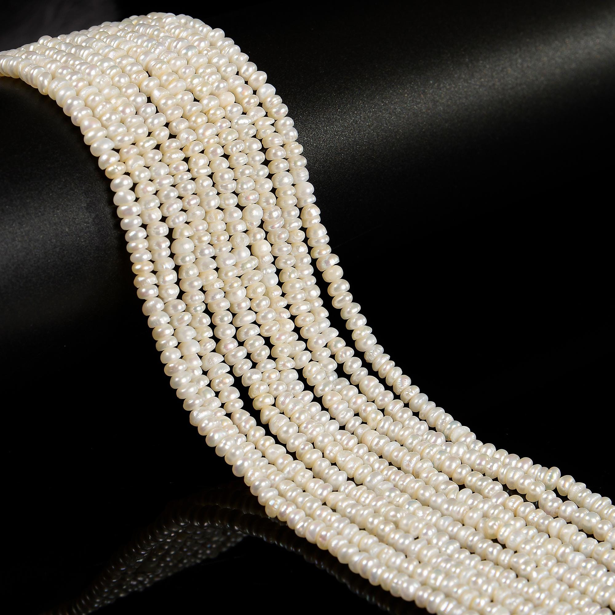 Grade A White Fresh Water Pearl Smooth Rondelle Button Beads 2x4mm 14'' Strand Grade A White Fresh Water Pearl Smooth Rondelle Button Beads 2x4mm 14'' Strand