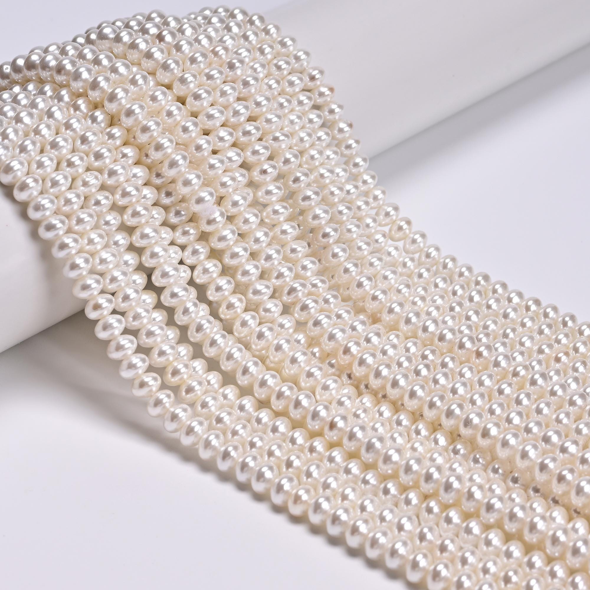 White Shell Pearl Smooth Rondelle Beads Size 3x5mm 15.5'' Strand White Shell Pearl Smooth Rondelle Beads Size 3x5mm 15.5'' Strand