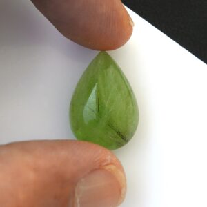 18ct Natural Peridot Gemstone, Pear Cabochon Cut with Ludwigite Inclusions - 14x20mm 18ct Natural Peridot Gemstone, Pear Cabochon Cut with Ludwigite Inclusions - 14x20mm
