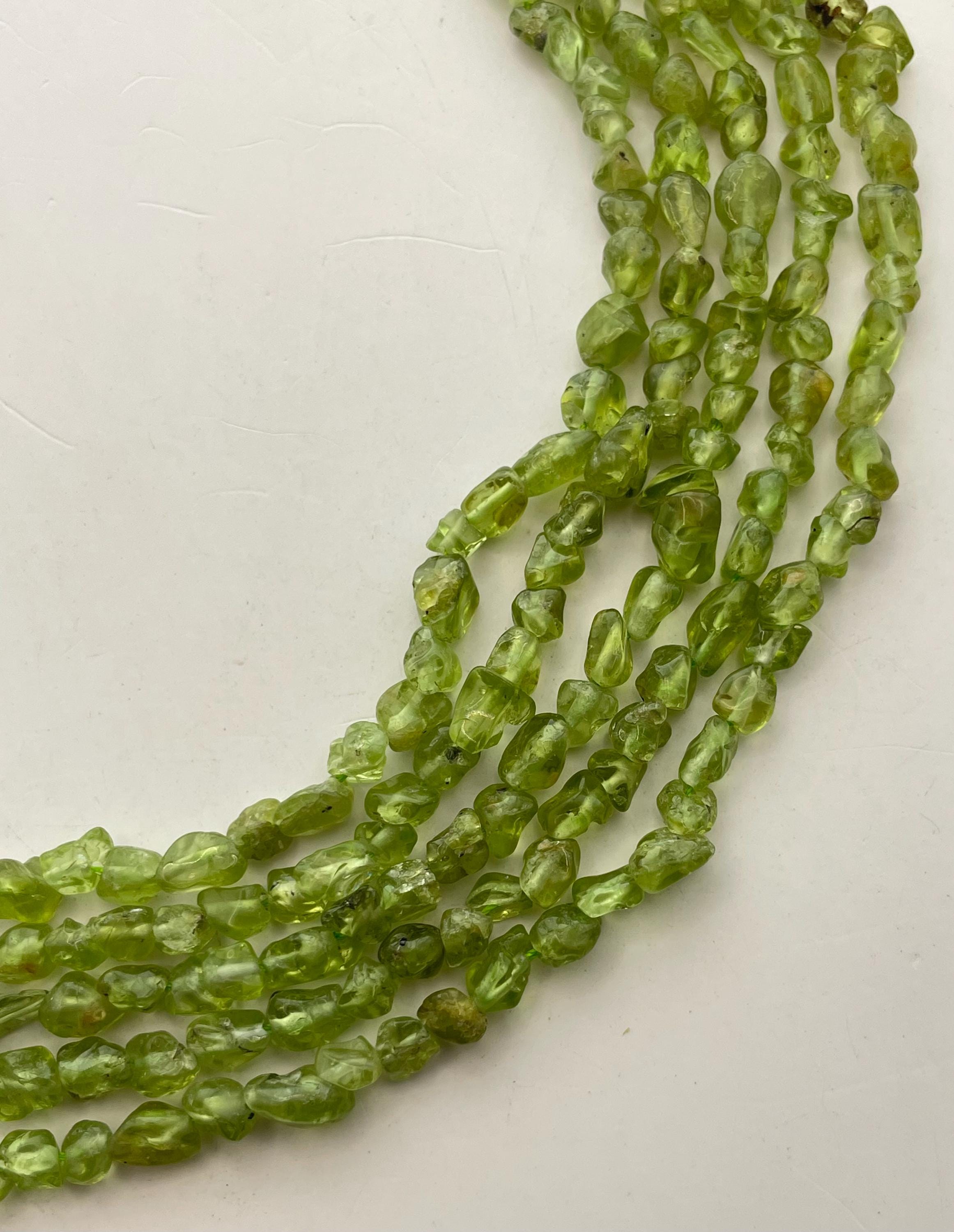 4-6mm Peridot Gemstone Nugget Beads. 15” Strands Of Small Peridot Gemstone Nuggets, Approximately 83-84 Per Strand. 4-6mm Peridot Gemstone Nugget Beads. 15” Strands Of Small Peridot Gemstone Nuggets, Approximately 83-84 Per Strand.