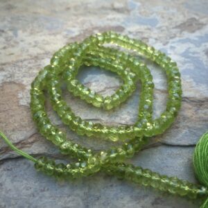 Faceted Peridot Rondelles, 4mm, 16 inch strand Faceted Peridot Rondelles, 4mm, 16 inch strand