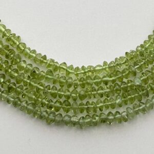 3-4mm Rondelle/button Peridot Gemstone Beads. 15” strand of rondelle Peridot beads, approx. 3-4mm in diameter and 2-3mm in width.