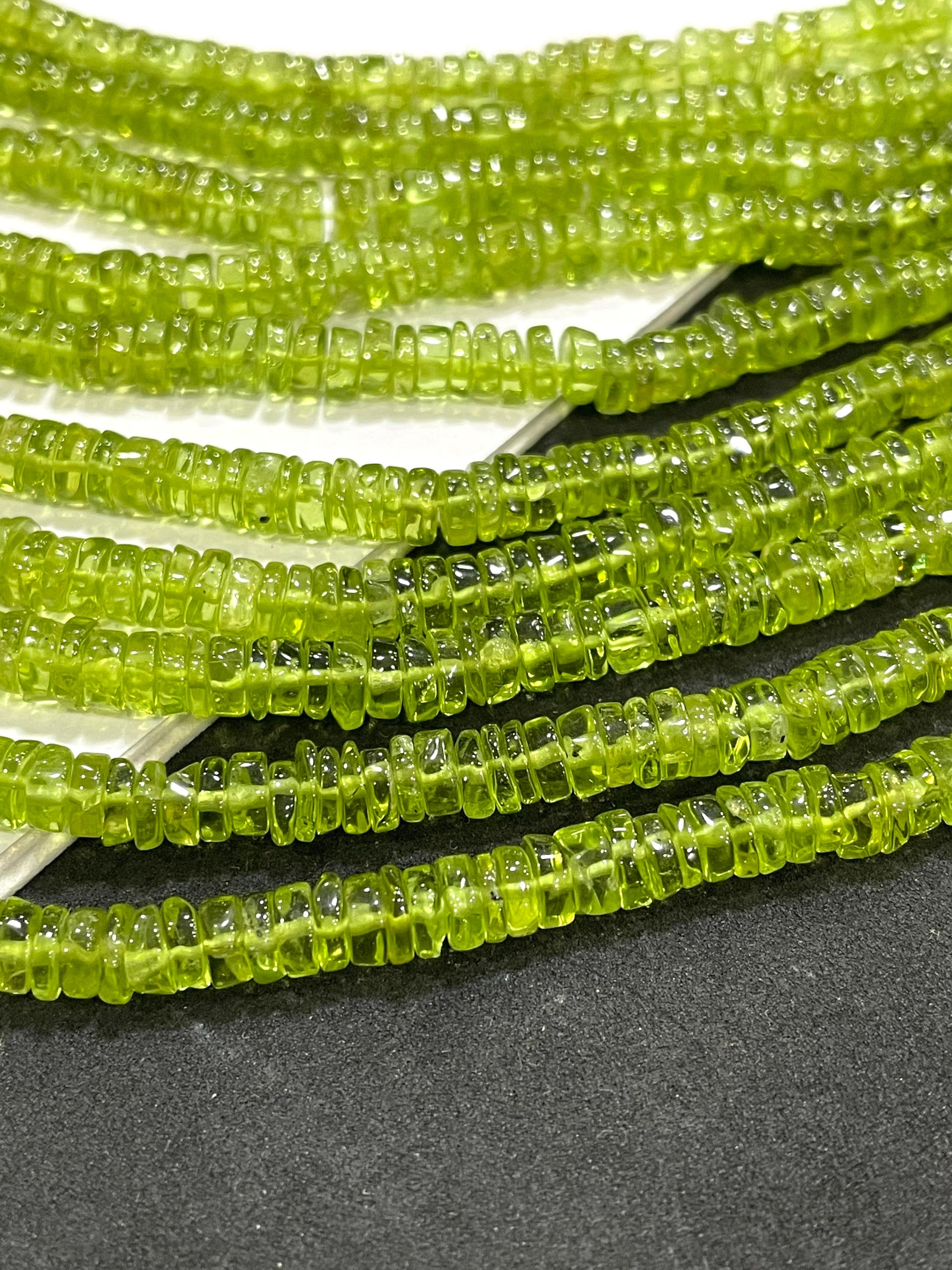 New Brand- Natural Peridot Smooth Tyre Shape Gemstone Beads Size- 5.5-6 Mm, 14 Inch Strand For Making Jewelry New Brand- Natural Peridot Smooth Tyre Shape Gemstone Beads Size- 5.5-6 Mm, 14 Inch Strand For Making Jewelry