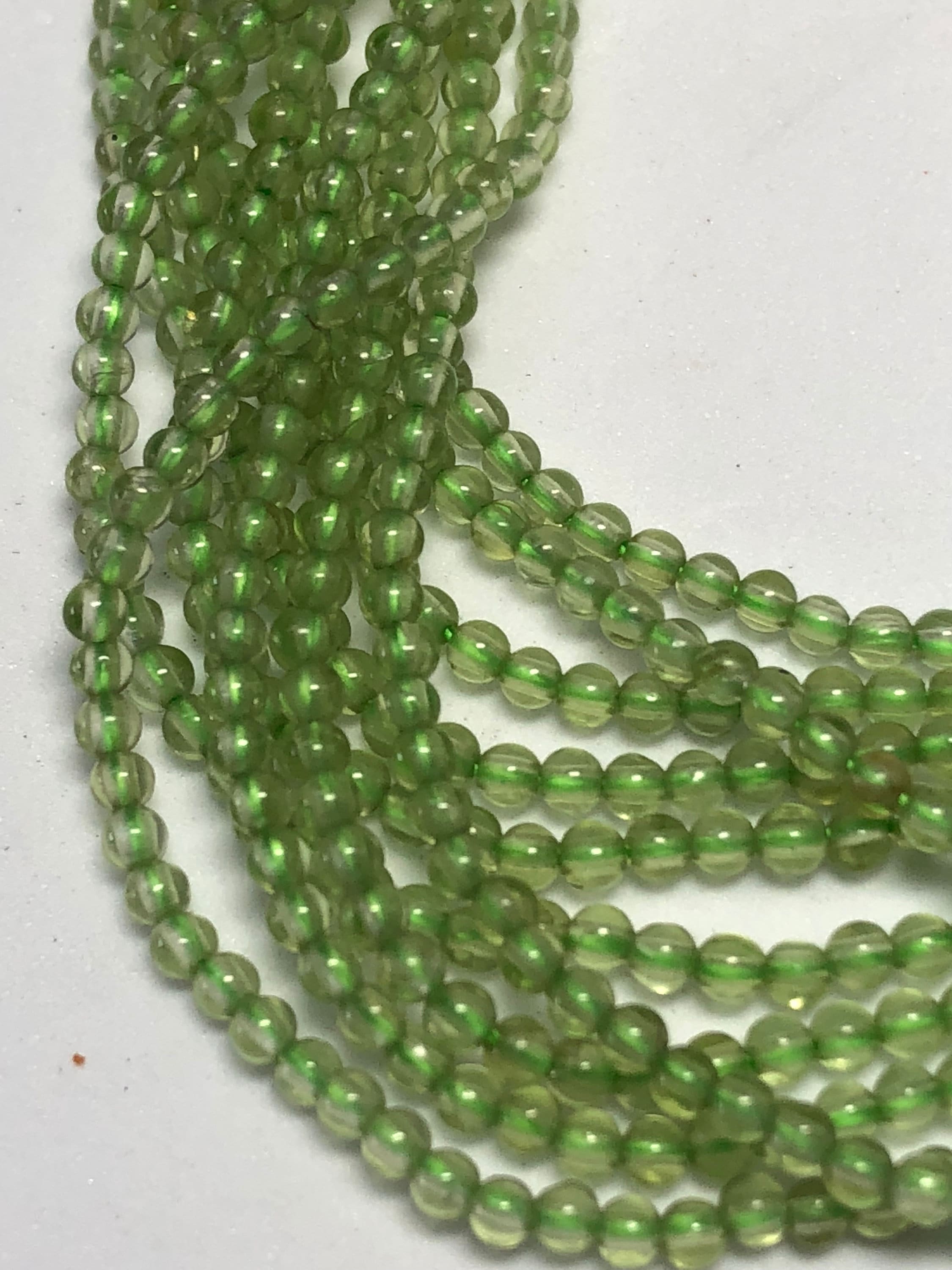 2mm Peridot Gemstone Beads. Full 15" Strand Of 2mm Smooth Round Beads. Very Uniform Is Size And Shape. August Birthstone.