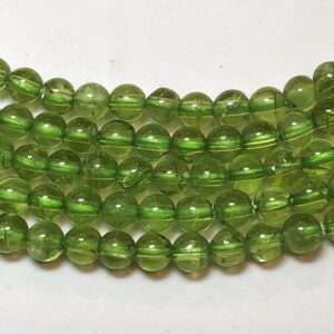 4mm Peridot Gemstone Beads. 15.5" strand of 4mm smooth round beads. Very uniform is size and shape. August birthstone.