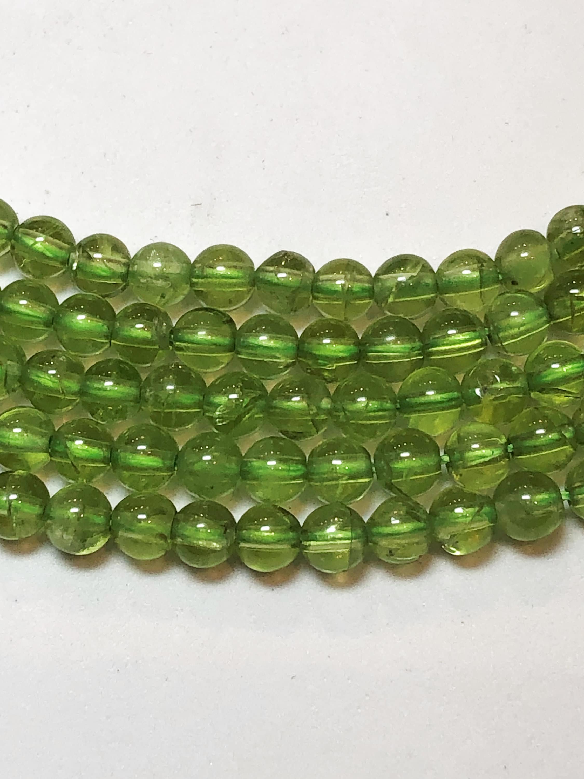 4mm Peridot Gemstone Beads. 15.5" Strand Of 4mm Smooth Round Beads. Very Uniform Is Size And Shape. August Birthstone.