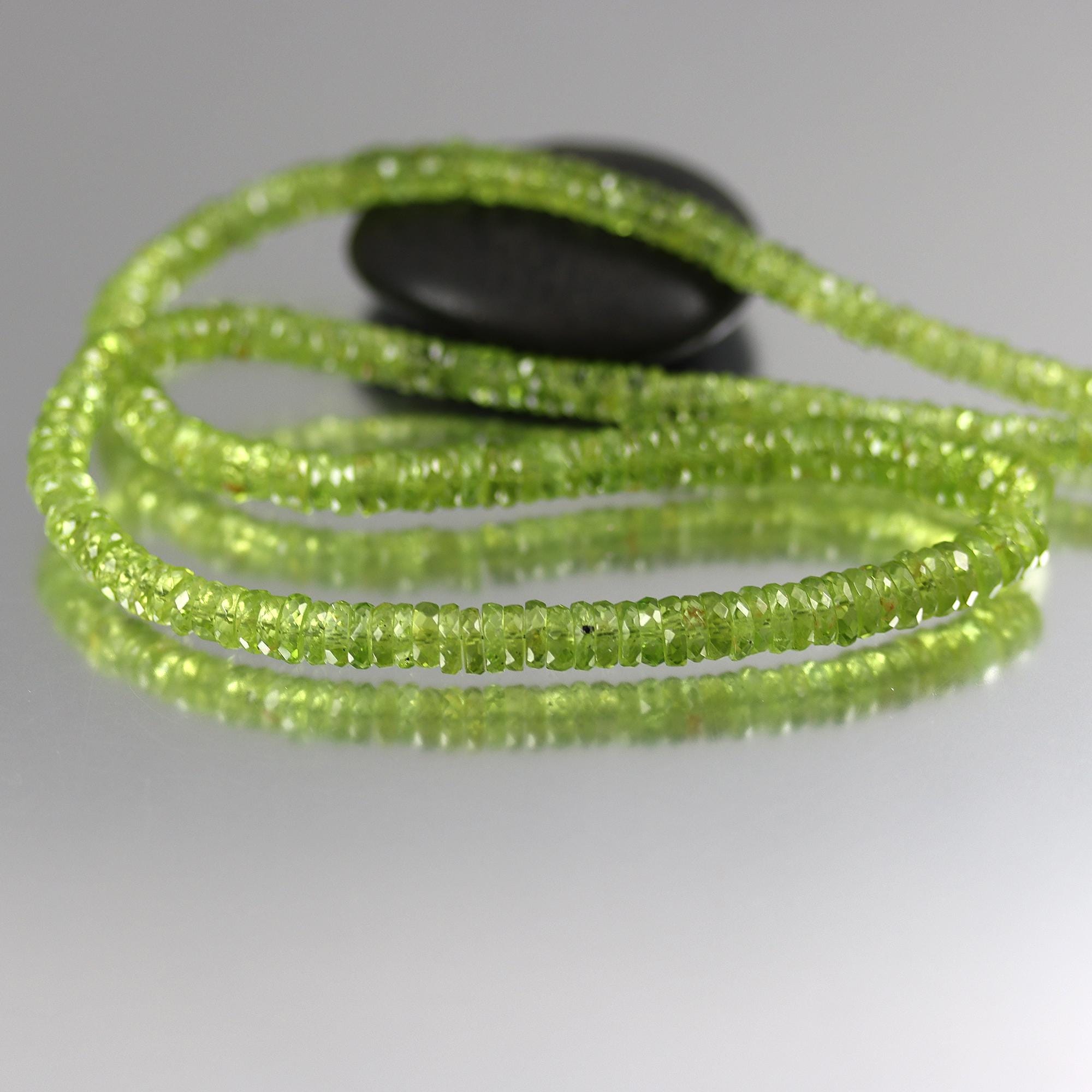 Round Peridot Heishi Beads - 4 To 5mm - By The Inch
