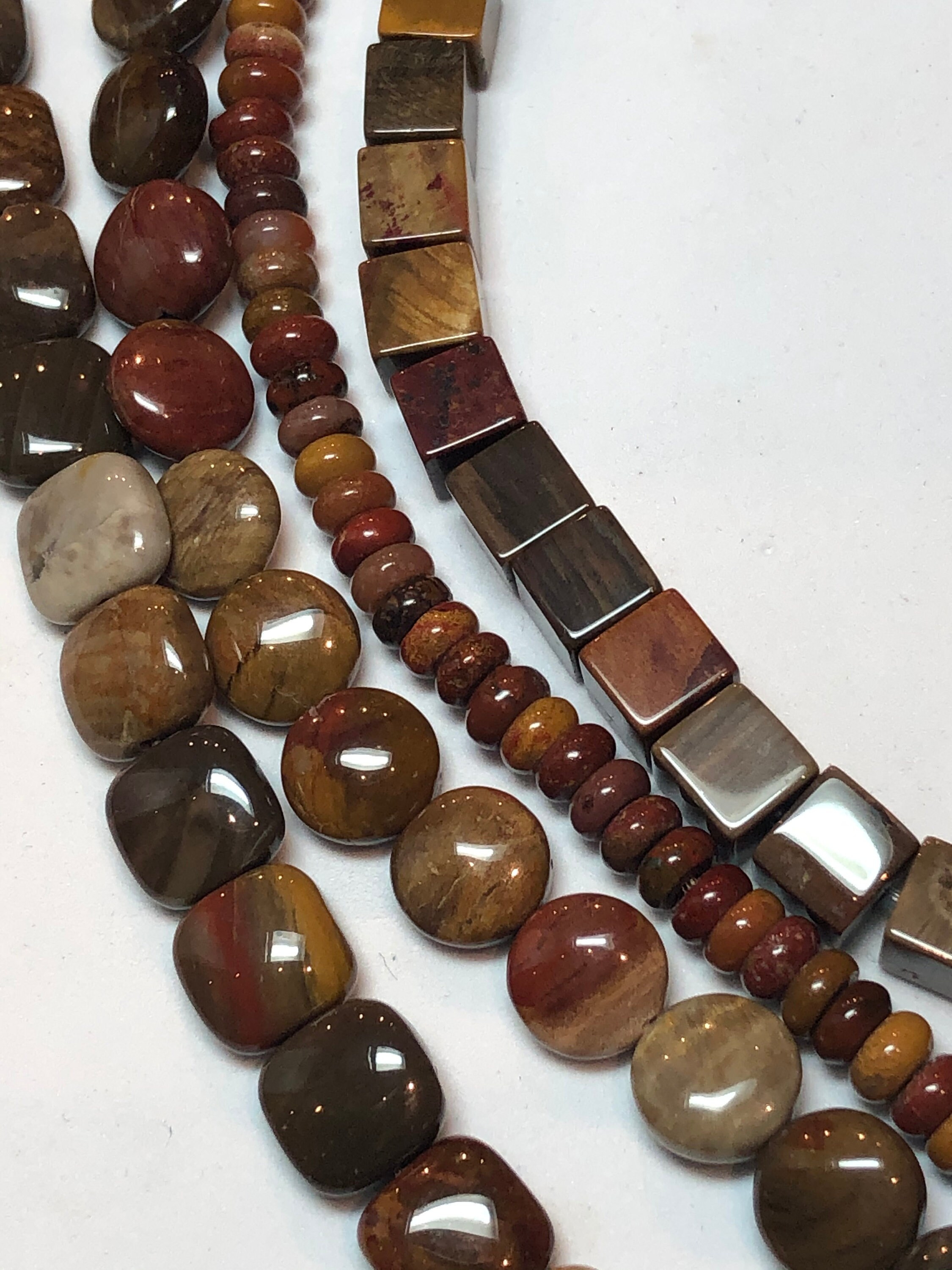 Petrified Wood Gemstone Beads In 4 Shapes: 8mm Square, 8mm Coin, 4mm Rondelle And 6mm Cube. Also Called Wooden Agate And Wooden Jasper. Petrified Wood Gemstone Beads In 4 Shapes: 8mm Square, 8mm Coin, 4mm Rondelle And 6mm Cube. Also Called Wooden Agate And Wooden Jasper.