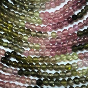 3mm Tourmaline Gemstone beads on a full 15" strand. High quality green and pink Tourmaline with hints of white, blue and black. 3mm Tourmaline Gemstone beads on a full 15" strand. High quality green and pink Tourmaline with hints of white, blue and black.