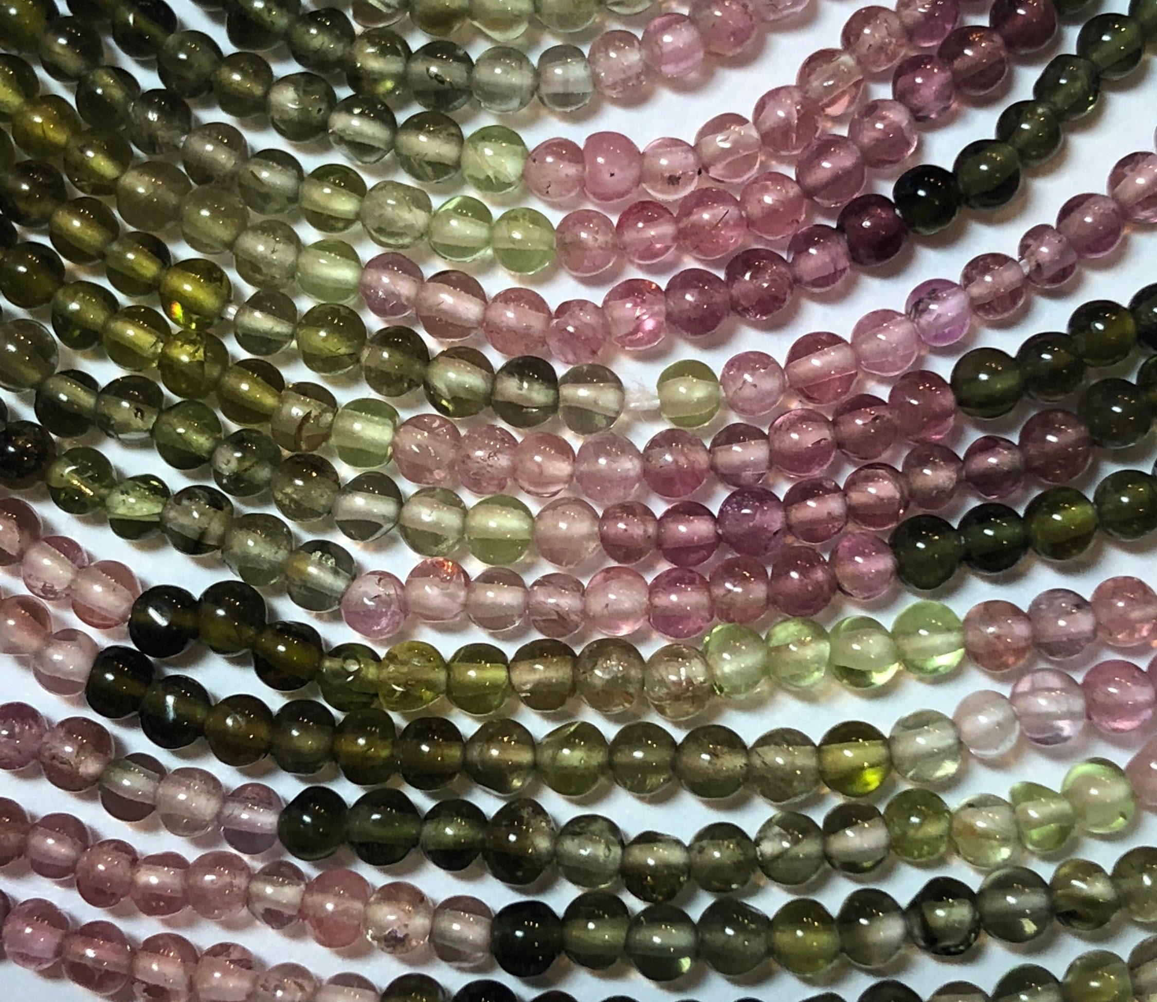 3mm Tourmaline Gemstone Beads On A Full 15" Strand. High Quality Green And Pink Tourmaline With Hints Of White, Blue And Black.