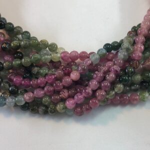 4mm Tourmaline Gemstone beads on a full 15" strand. High quality green and pink Tourmaline with hints of white, blue and black. 4mm Tourmaline Gemstone beads on a full 15" strand. High quality green and pink Tourmaline with hints of white, blue and black.