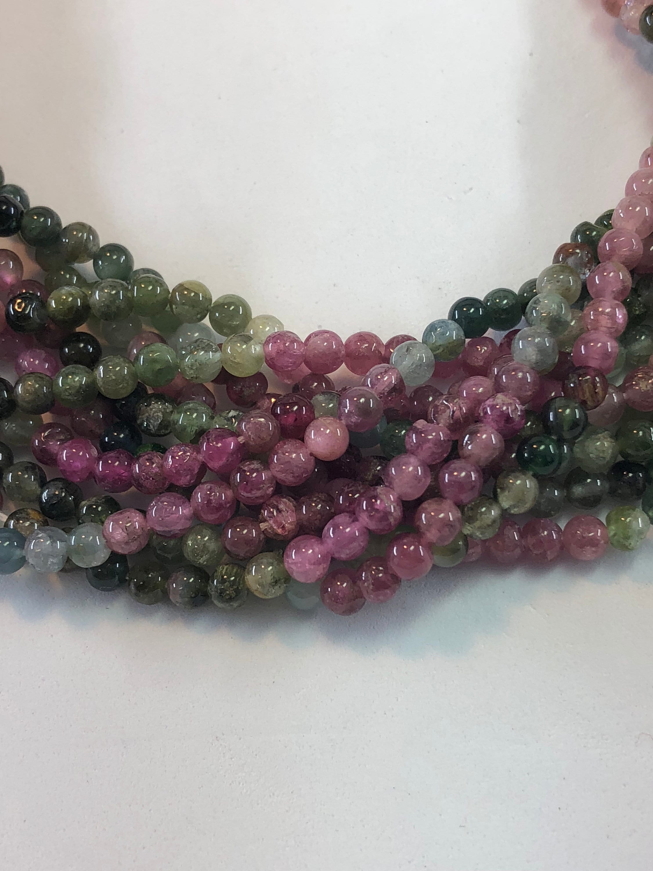 4mm Tourmaline Gemstone Beads On A Full 15" Strand. High Quality Green And Pink Tourmaline With Hints Of White, Blue And Black.
