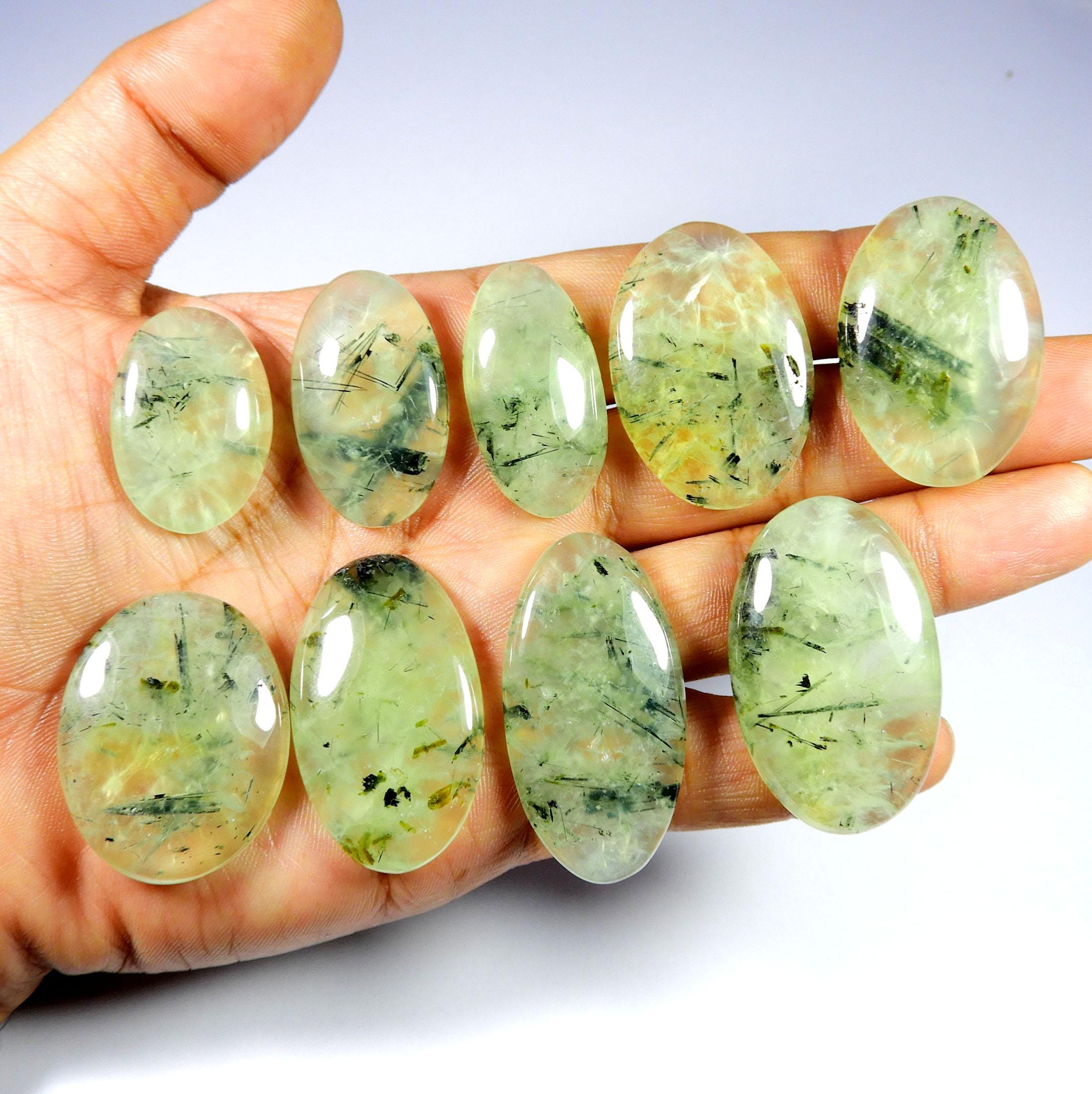 Green Prehnite Cabochon. Green Rutlated Prehnite Gemstone. Natural Black Needle Prehnite. Oval Shape Wholesale Polished Prehnite For Jewelry Green Prehnite Cabochon. Green Rutlated Prehnite Gemstone. Natural Black Needle Prehnite. Oval Shape Wholesale Polished Prehnite For Jewelry