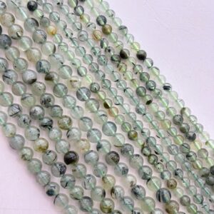Prehnite Gemstone Beads. 15" Strand Of Round Beads, Avail. In 6 And 8mm. Translucent Light Green With Epidote Inclusions. Stress Reducer. Prehnite Gemstone Beads. 15" Strand Of Round Beads, Avail. In 6 And 8mm. Translucent Light Green With Epidote Inclusions. Stress Reducer.