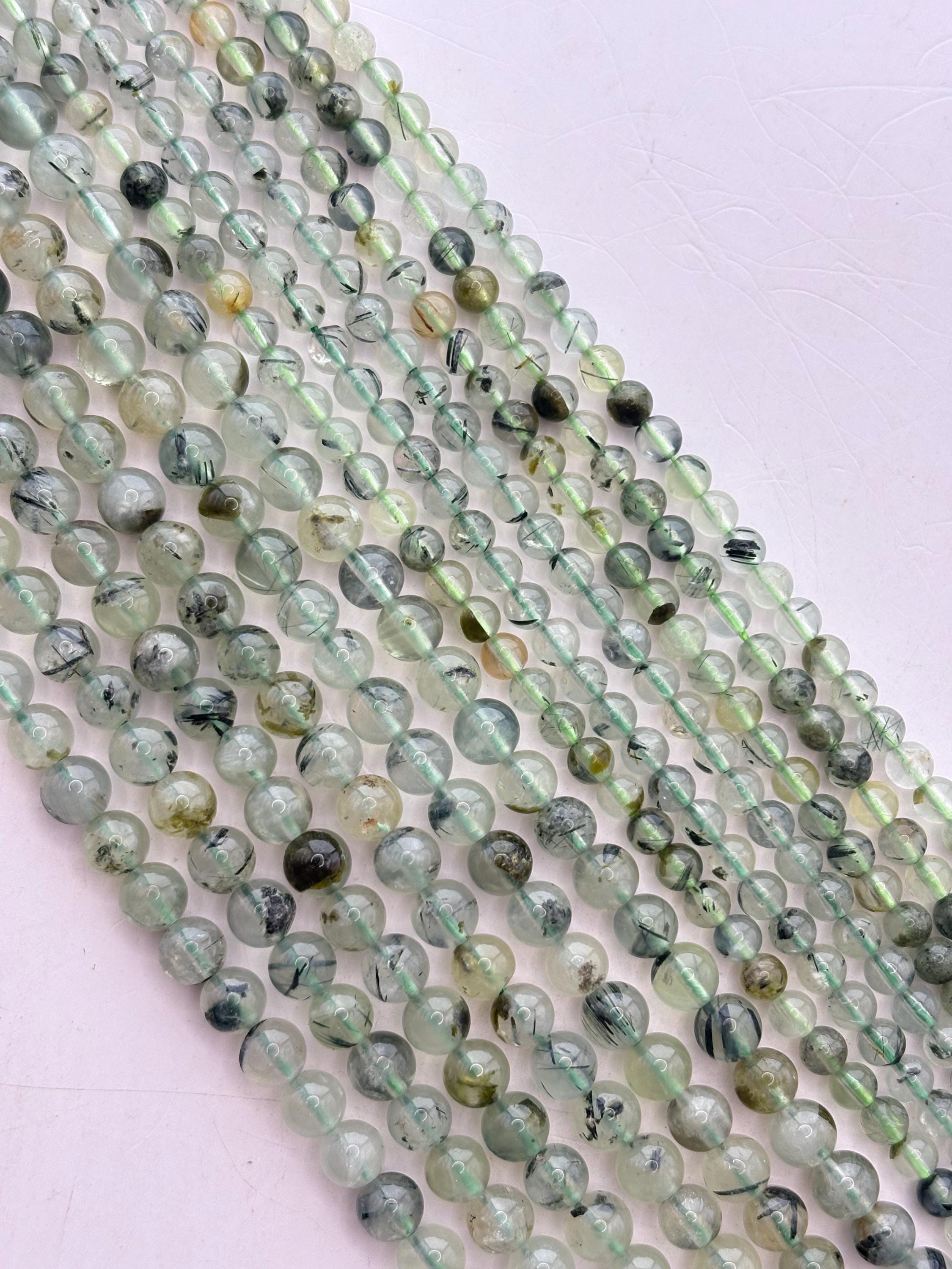 Prehnite Gemstone Beads. 15" Strand Of Round Beads, Avail. In 6 And 8mm. Translucent Light Green With Epidote Inclusions. Stress Reducer. Prehnite Gemstone Beads. 15" Strand Of Round Beads, Avail. In 6 And 8mm. Translucent Light Green With Epidote Inclusions. Stress Reducer.