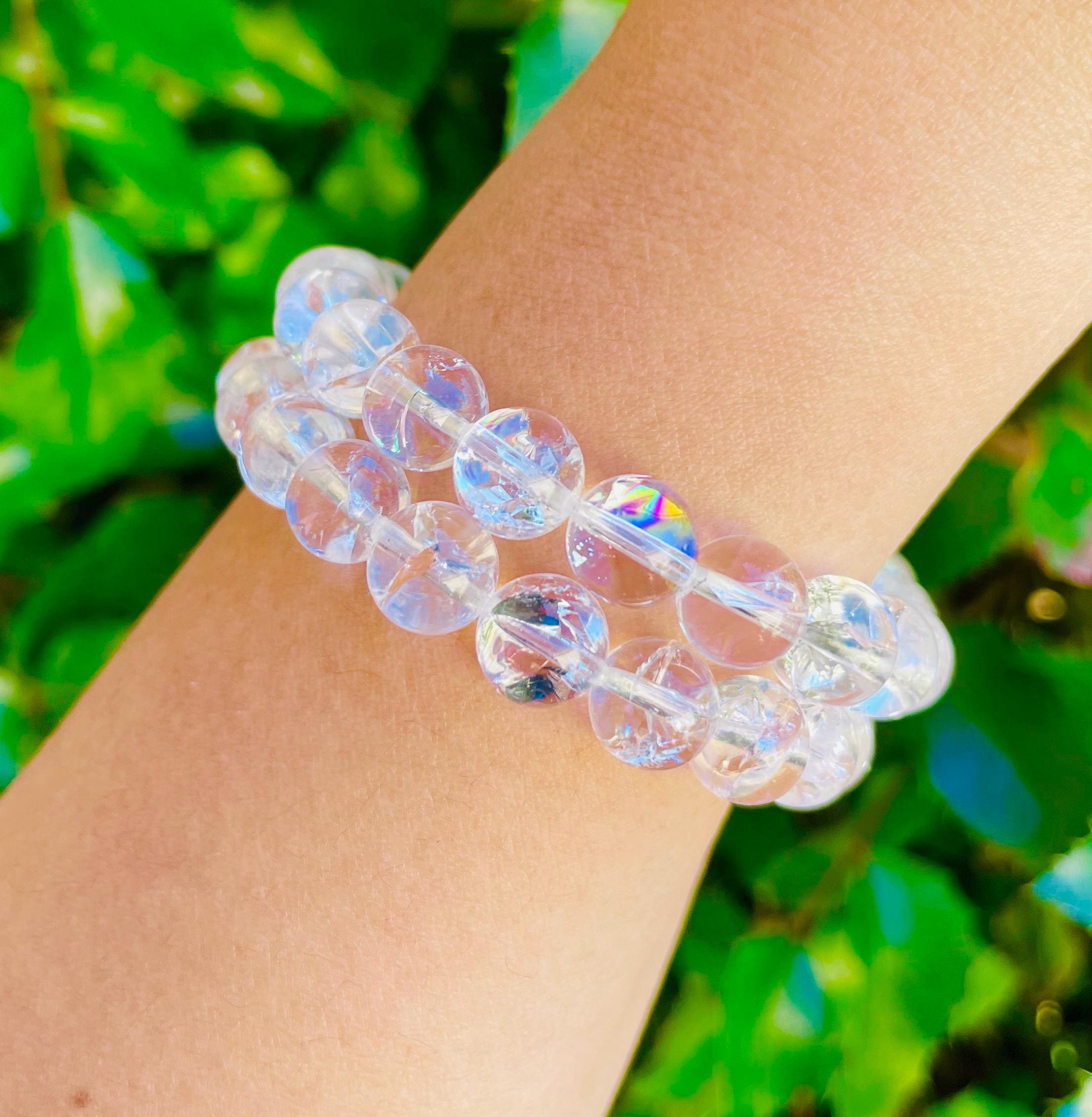 Clear Quartz Crystal Bracelet With Silver Flower Rainbow Reflections