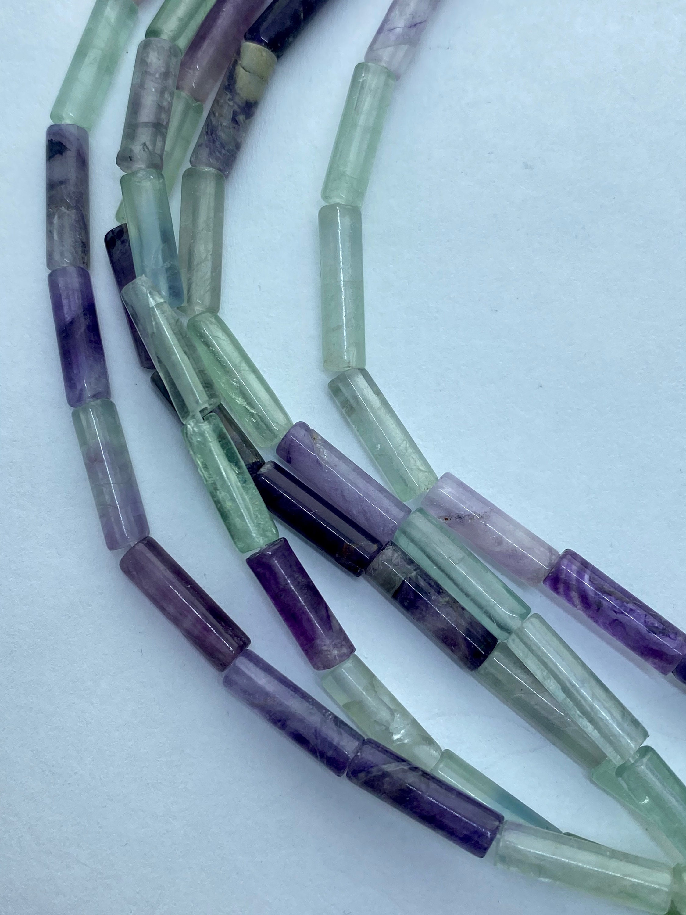 4x13mm Tube Rainbow Fluorite Gemstone Beads. 15" Strand Of Green And Purple Tube Beads, 30 Per Strand. 4x13mm Tube Rainbow Fluorite Gemstone Beads. 15" Strand Of Green And Purple Tube Beads, 30 Per Strand.