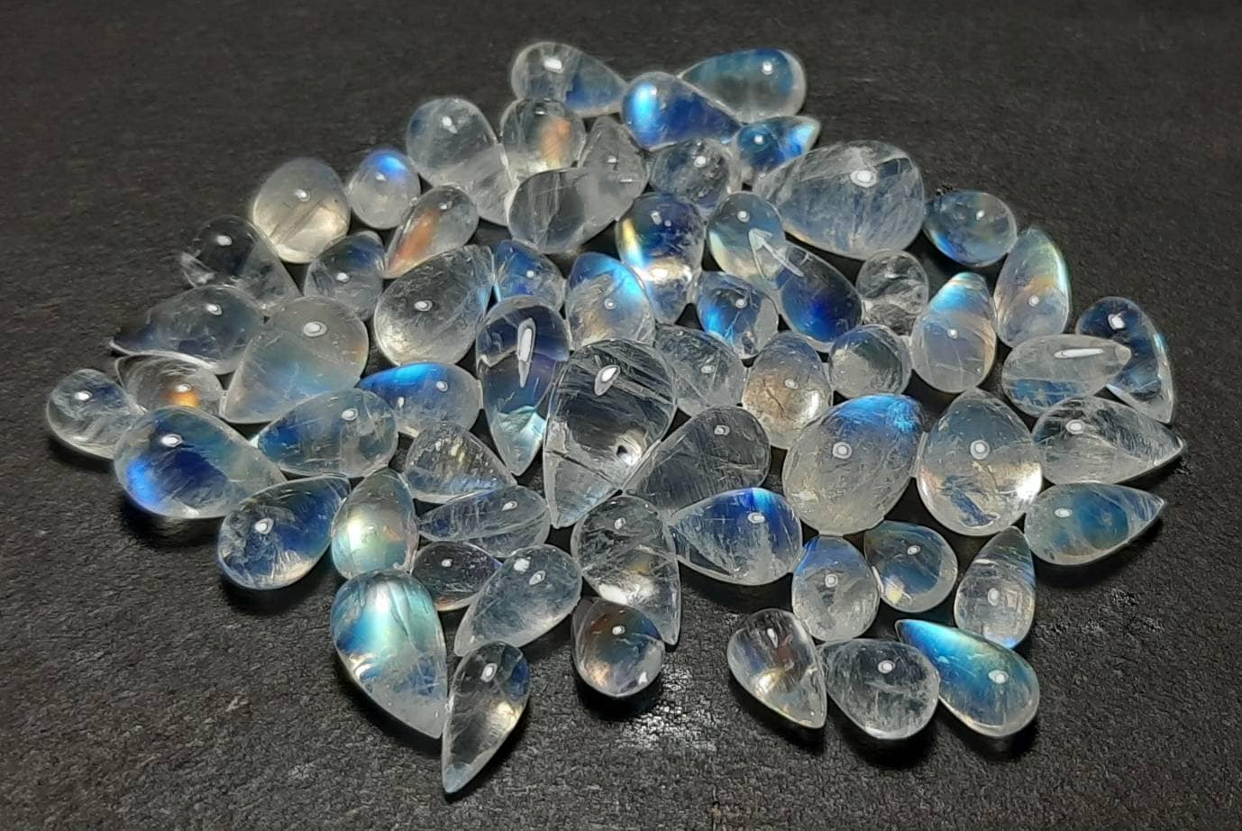 Rainbow Moonstone Cabochon Drops: Blue Flash Gemstone (5x7 To 7x11 Mm) Rainbow Moonstone Cabochon Drops: Blue Flash Gemstone (5x7 To 7x11 Mm)