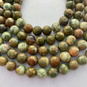 10mm Green Rhyolite Gemstone Beads. 15” strand of high quality round beads, about 38 per strand. Mix of light and dark Rhyolite. Ryolite. 10mm Green Rhyolite Gemstone Beads. 15” strand of high quality round beads, about 38 per strand. Mix of light and dark Rhyolite. Ryolite.