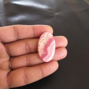 Polished Rhodochrosite Cabochon: 55 Carat Gemstone, Oval Shape 36x21x6 Mm Polished Rhodochrosite Cabochon: 55 Carat Gemstone, Oval Shape 36x21x6 Mm