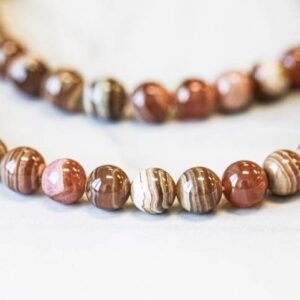 Brown Rhodochrosite 8mm / 10mm Beads 16" Strand Brown Rhodochrosite 8mm / 10mm Beads 16" Strand