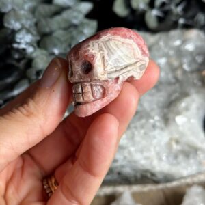 Rhodochrosite Crystal Skull: Carved Gemstone Skull
