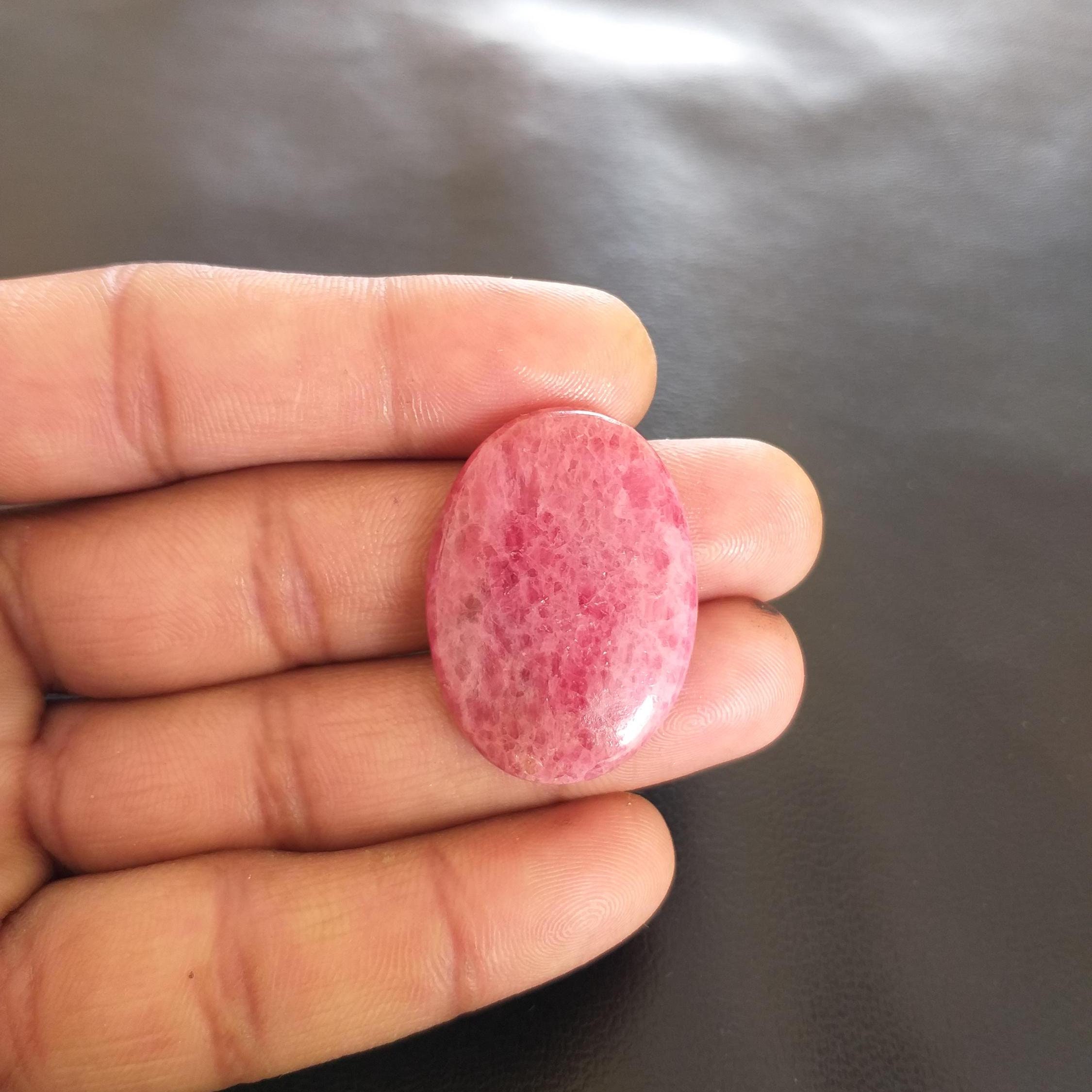 Oval Rhodonite Cabochon: 51.4 Carat Gemstone For Pendant (34x24x6 Mm