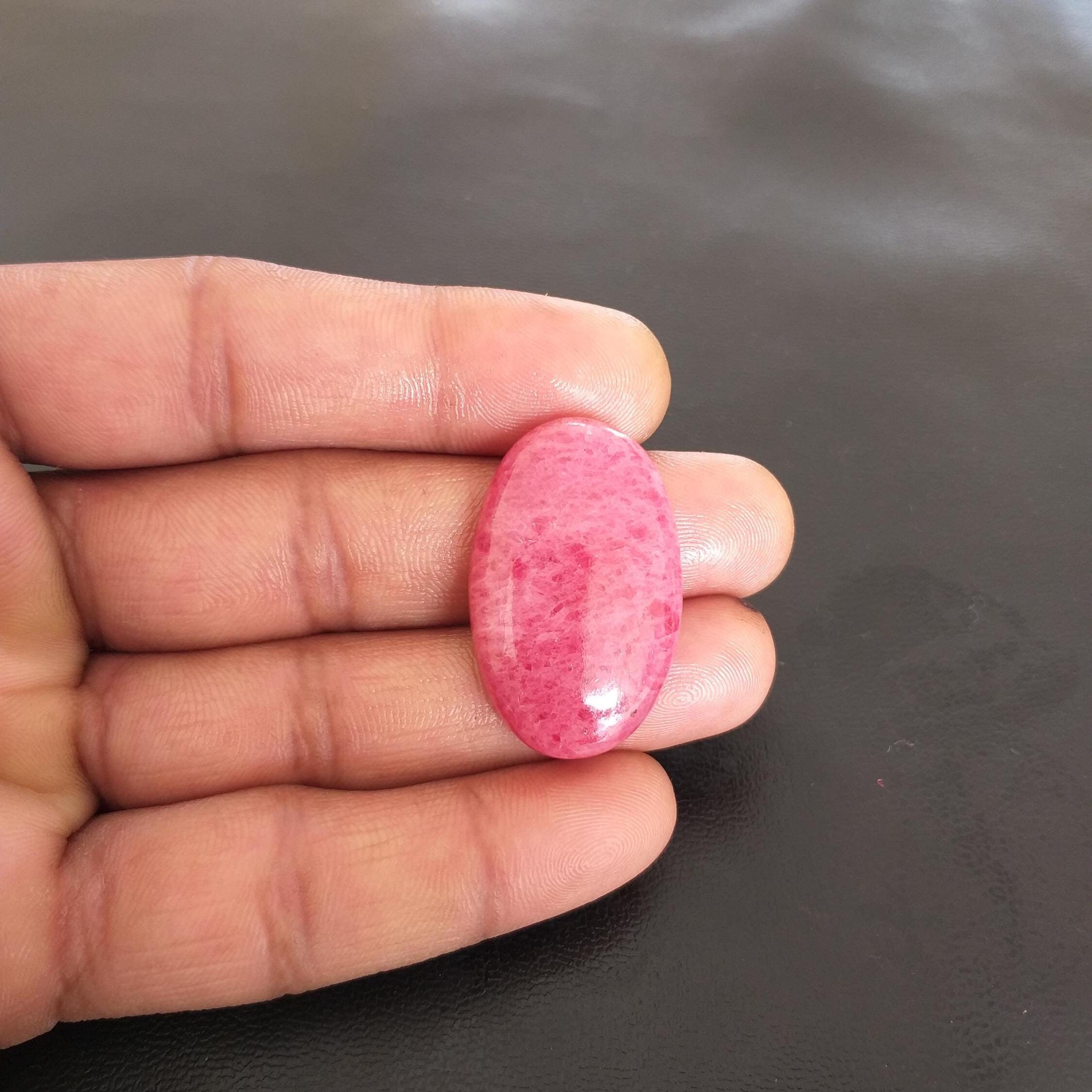 Oval Rhodonite Cabochon: 52.6 Carat Gemstone For Pendant (34x22x7 Mm