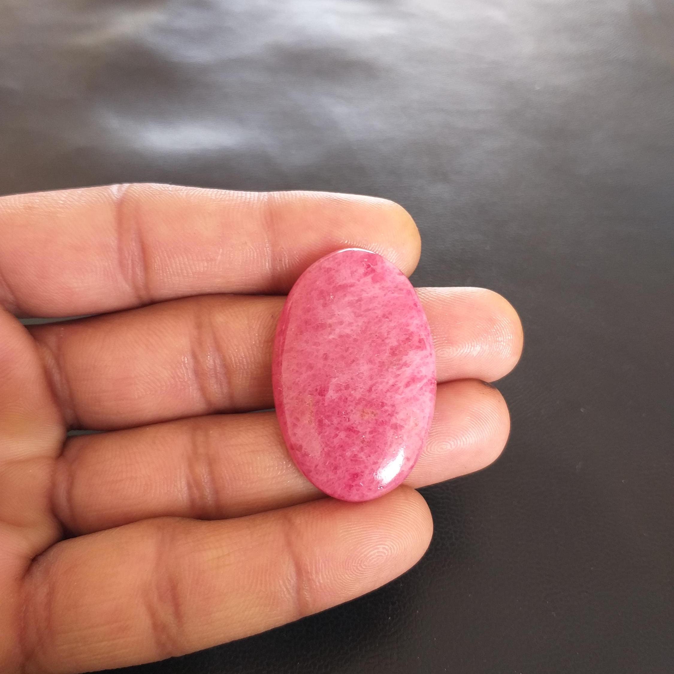 Oval Rhodonite Cabochon: 59.8 Carat Aaa Grade Gemstone, 39x25x6 Mm