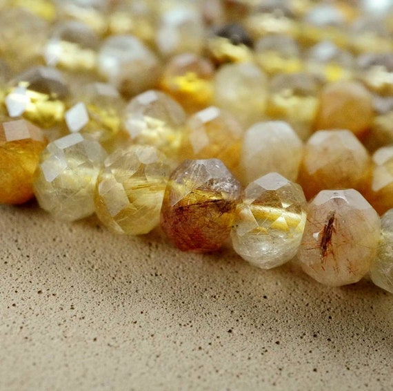Golden Rutilated Quartz (rondelle)(faceted)(6x4mm)(15.5"strand) Golden Rutilated Quartz (rondelle)(faceted)(6x4mm)(15.5"strand)